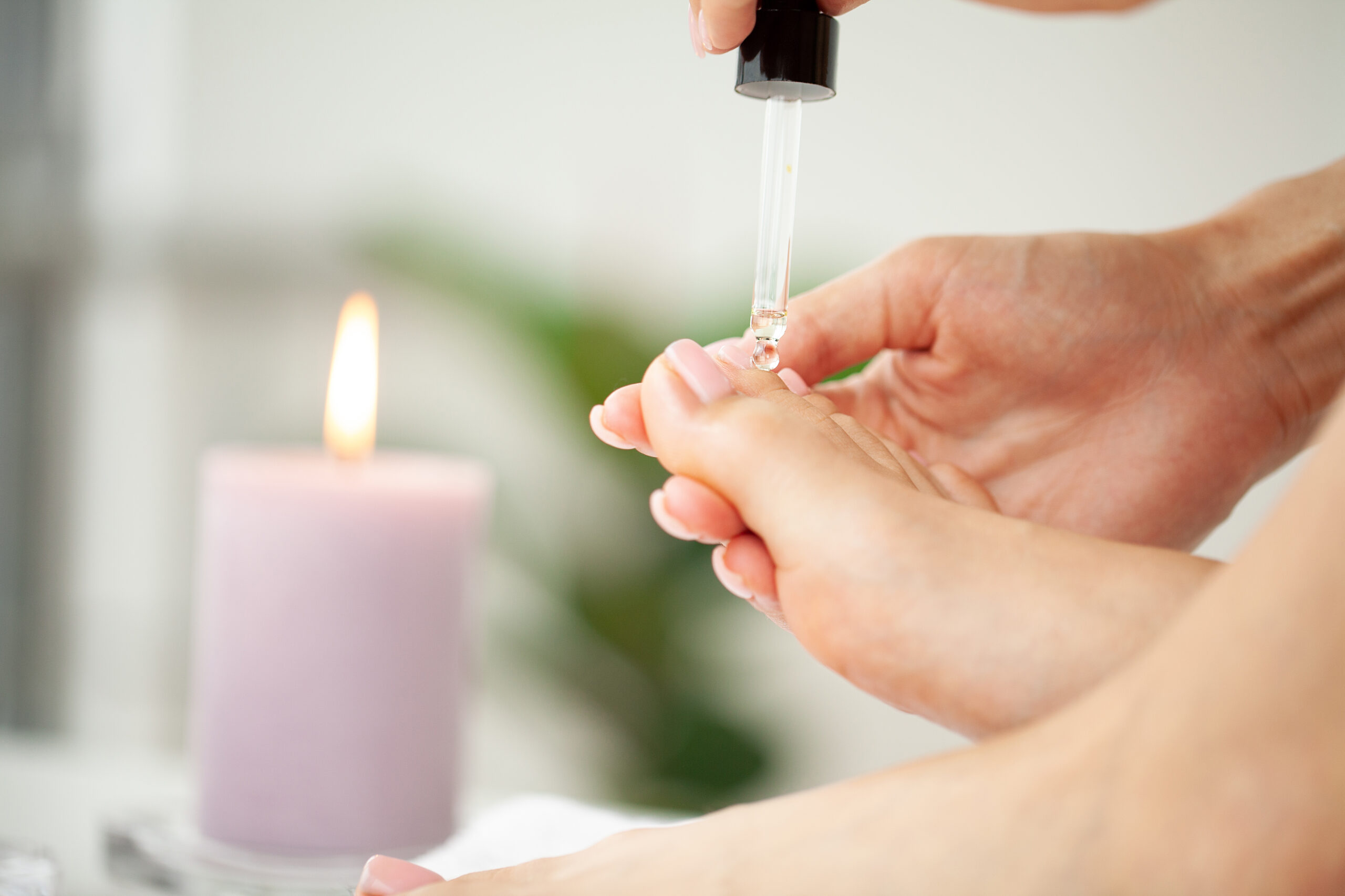 Woman Doing Pedicure Caring For Fingernails At Home.